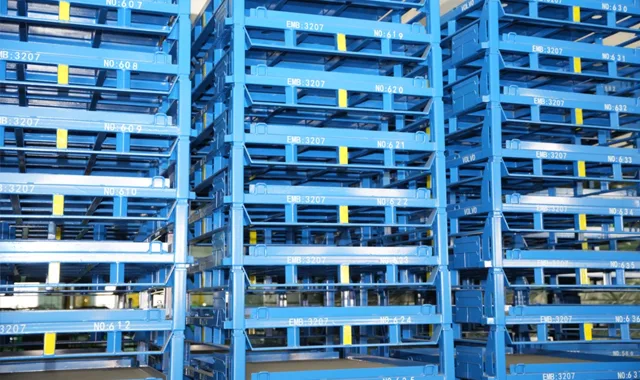 Steel pallet boxes stacked in a warehouse yard